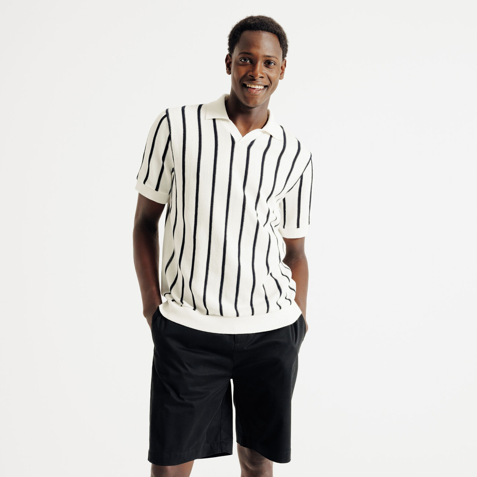 Polo in tricot met fantasie stekenpatroon en resor