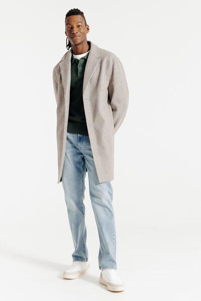 Polo in tricot met fantasie stekenpatroon en knoop