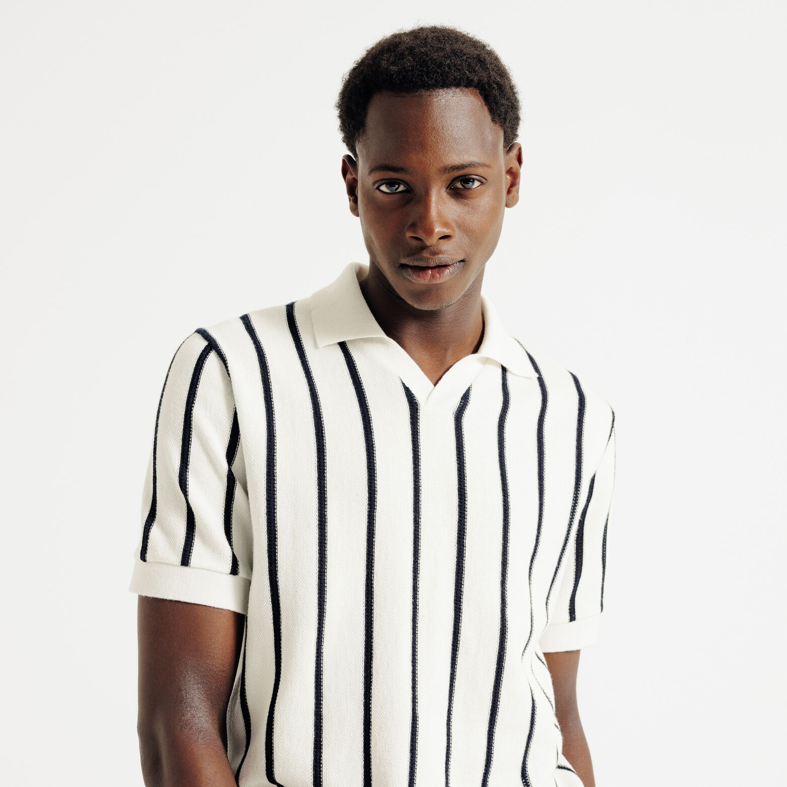 Polo in tricot met fantasie stekenpatroon en resor