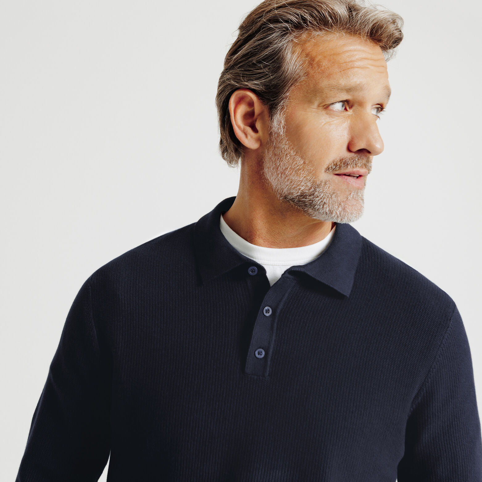 Polo in tricot met fantasie stekenpatroon en knoop