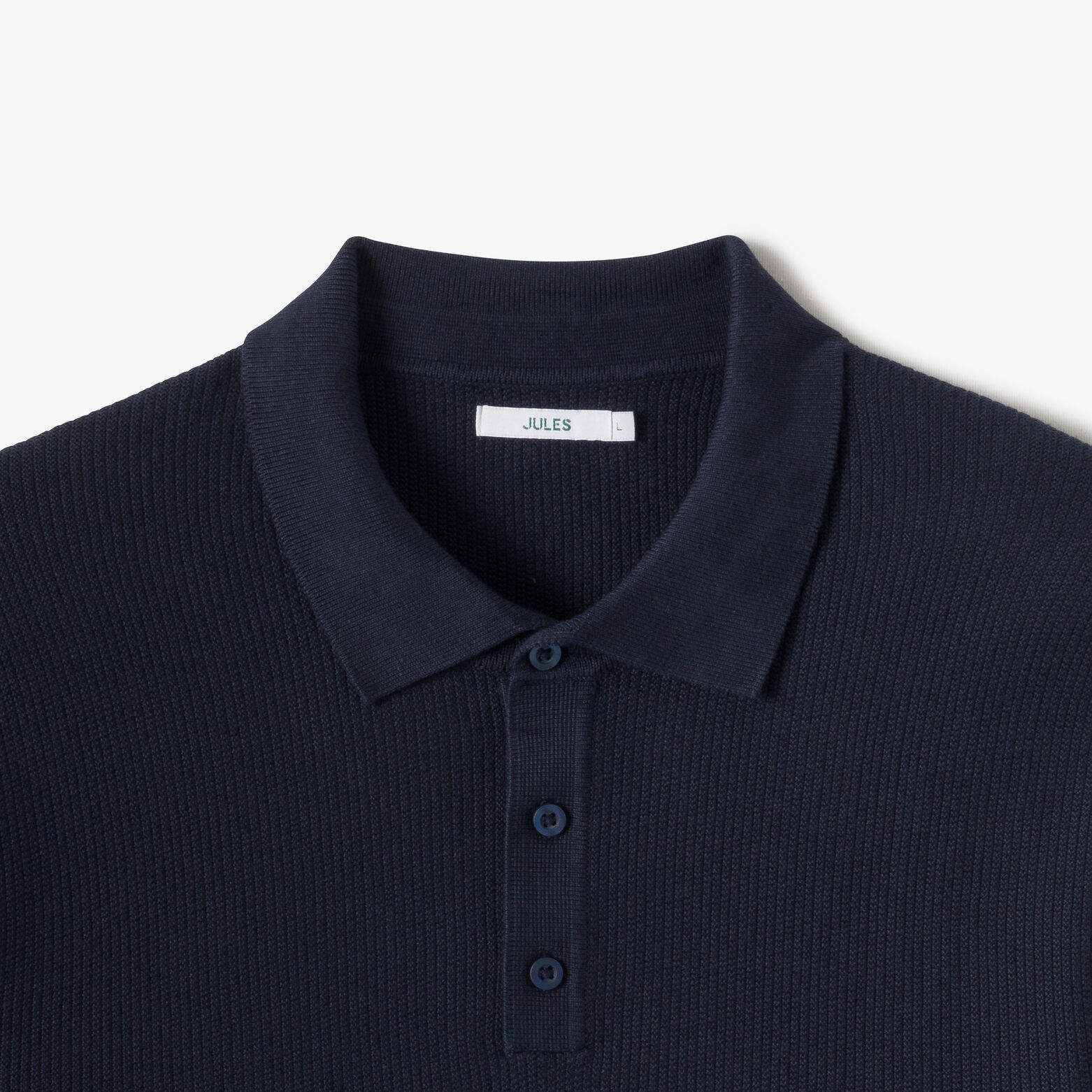 Polo in tricot met fantasie stekenpatroon en knoop