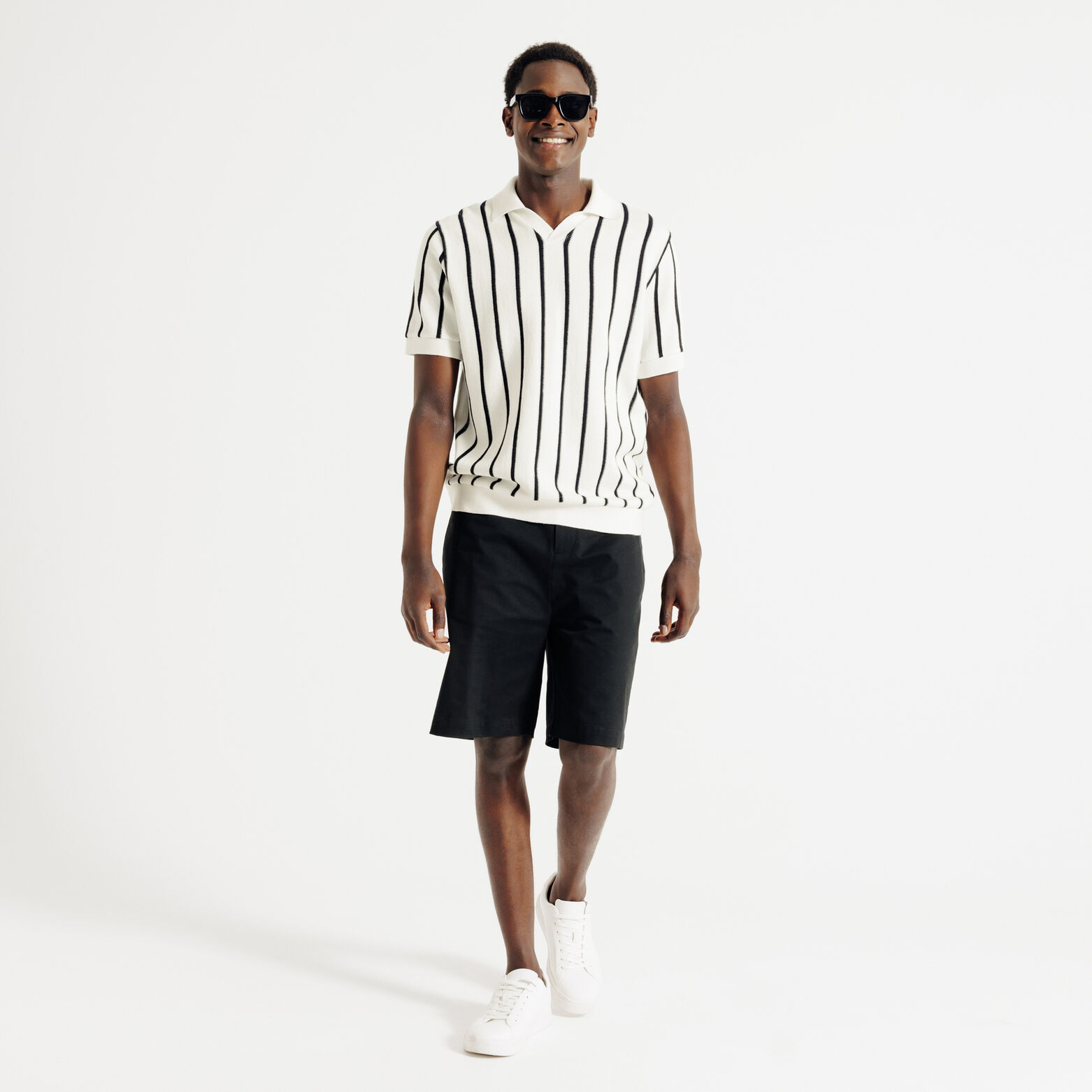 Polo in tricot met fantasie stekenpatroon en resor