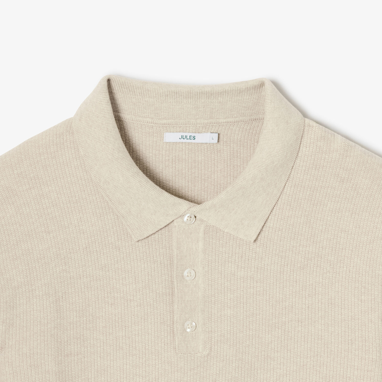 Polo in tricot met fantasie stekenpatroon en knoop