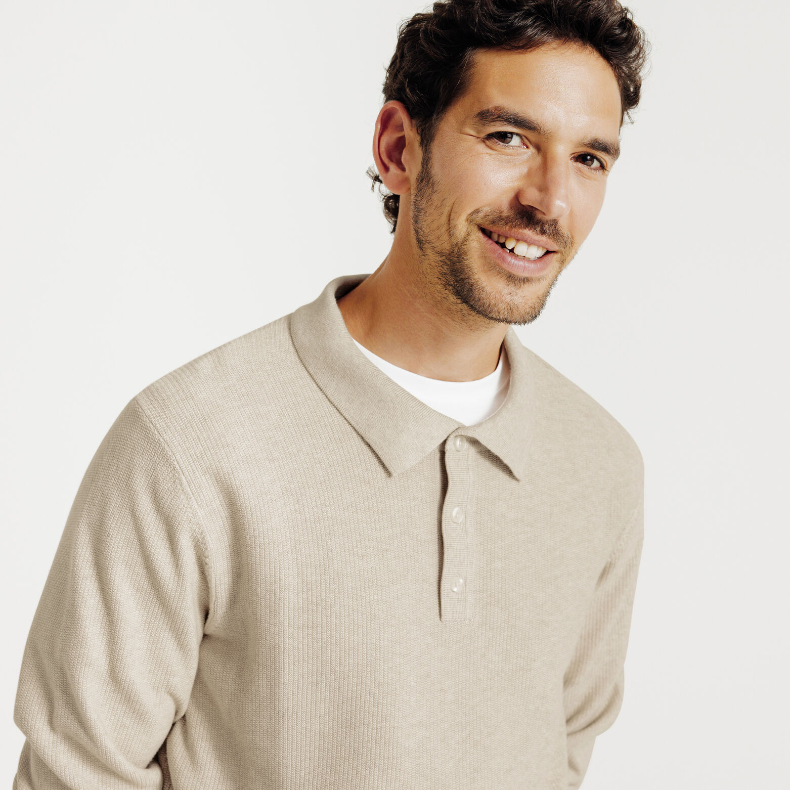 Polo in tricot met fantasie stekenpatroon en knoop