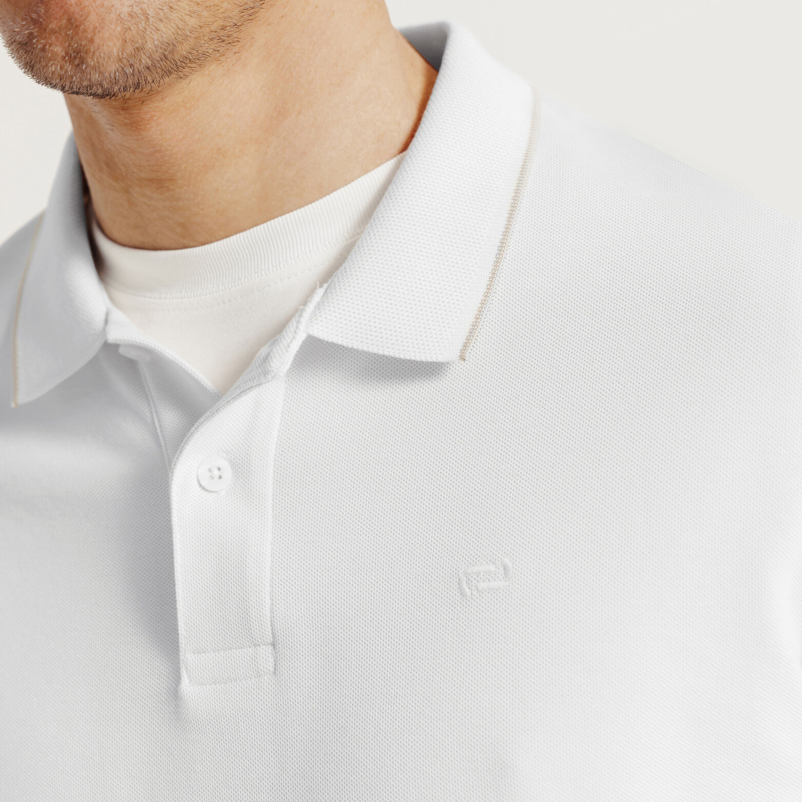 Effen polo in piqu&eacute;katoen, met lange mouwen